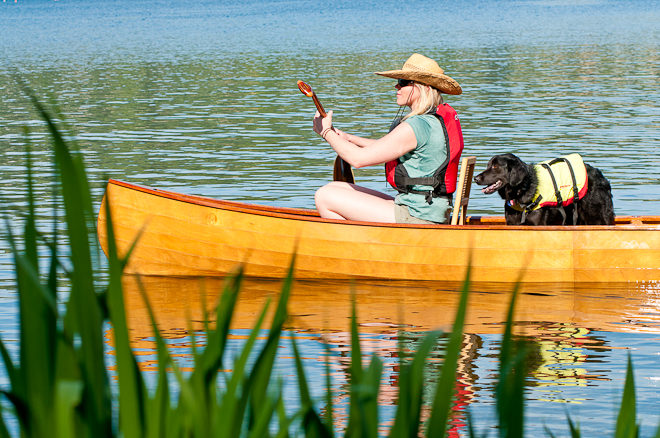 canoest with paddle and dog